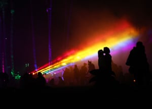 People gather beneath rainbow lights after Cinespia’s screening of The Wizard of Oz at Hollywood Forever cemetery