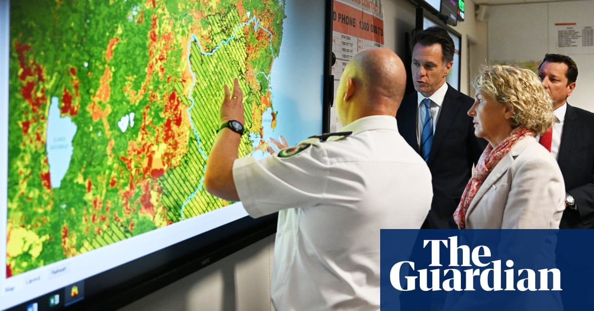 NSW fires: prime minister warns of challenging summer as homes destroyed on NSW south coast