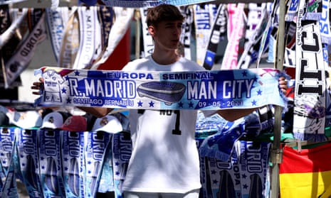 A match scarf is sold at a merchandising stall in Madrid before last year’s Champions League semi-final.
