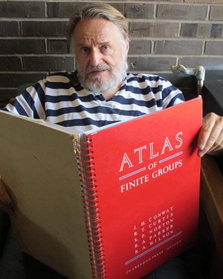John Horton Conway with the Atlas of Finite Groups (1985), co-authored by Simon Norton, Robert Curtis, Richard Parker and Robert Wilson.