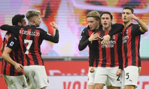 Milan’s Davide Calabria celebrates scoring their first goal with team mates.