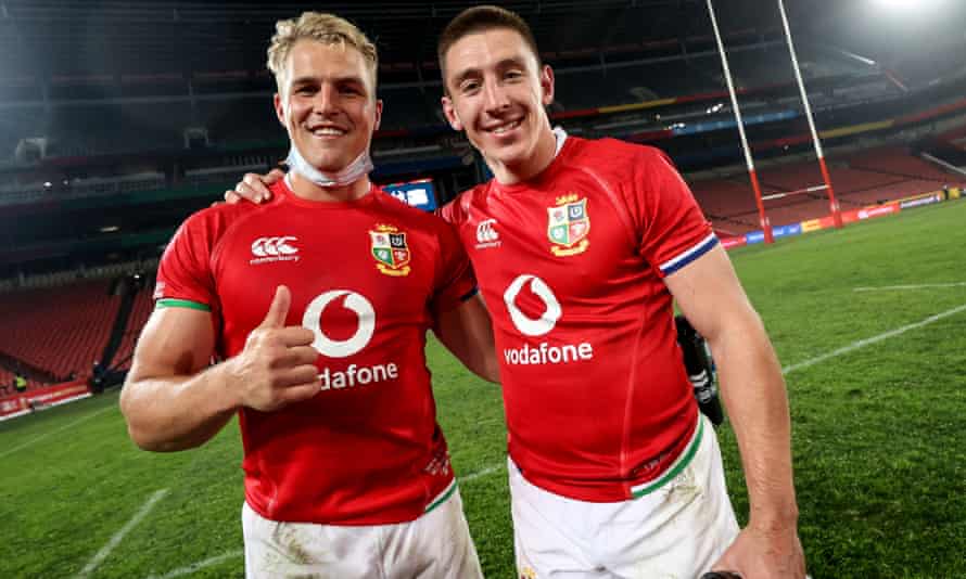 Josh Adams celebrates with Duhan Van der Merwe, who also scored a hat-trick.