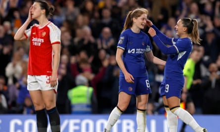 Sjoeke Nüsken (middle) celebrates her side’s third goal with Johanna Rytting Kaneryd as Lotte Wubben-Moy looks defeated during the Women’s Super League match between Chelsea and Arsenal at Stamford Bridge in London on 15 March 2024
