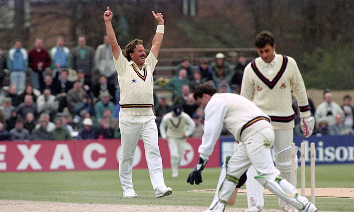 Durham’s Ian Botham (l) celebrates taking the wicket of Lancashire’s Mike Watkinson (r) in his debut first-class appearance for the county in 1992