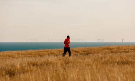 Writer Christian Donlan, who has multiple sclerosis and took up running in 2021, runs along the South Downs near his home in East Sussex, UK, August 2022