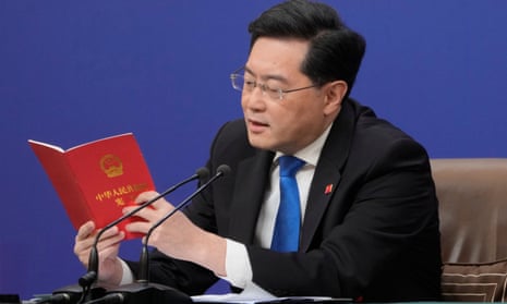 Chinese Foreign Minister Qin Gang reads from the Chinese constitution.