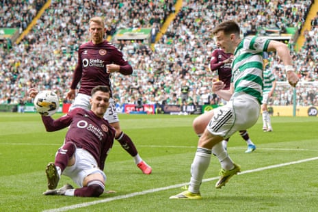 A cross from Celtic’s Kieran Tierney strikes the arm of Hearts’ Alexandros Kyziridis and the referee points to the spot.