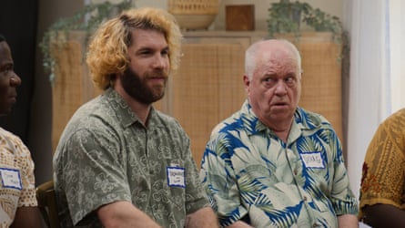 Two men sat on chairs