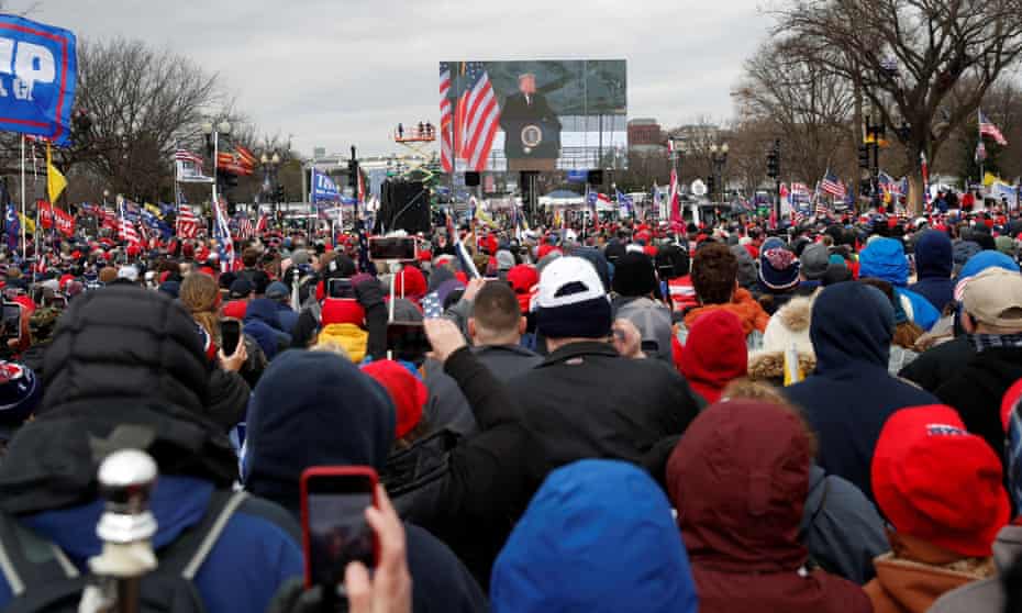 President Donald Trump is seen on a screen speaking to supporters during a rally to contest the certification of the 2020 US presidential election results in Washington on 6 January. 