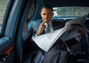 Obama sits in a limo en route to the White House, one year into his presidency, after an education event in Fairfax, Virginia