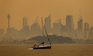 Smoke haze from bushfires shrouds Sydney Harbour.