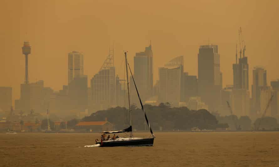 Smoke haze from bushfires shrouds Sydney Harbour.