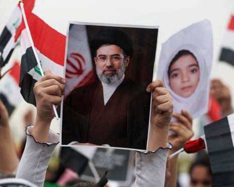 Schoolgirl holds portrait of Iran's new leader Mojtaba Khamenei