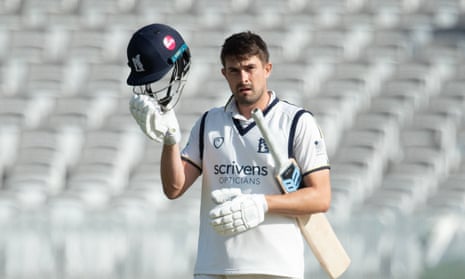 Will Rhodes with bat tucked under arm
