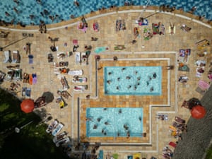 Overhead view of bathers in an around two pools