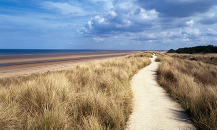 Path through marram grass by sea on sunny day at Holme next the Sea
