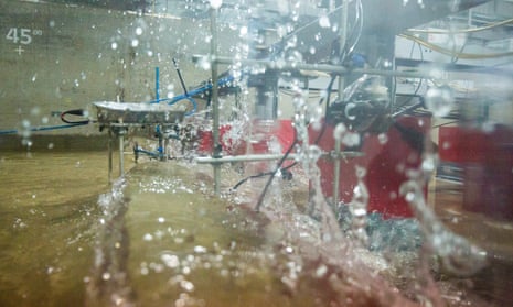 A generated tsunami wave breaks in the 70-metre-long tank at HR Wallingford research centre in Oxfordshire