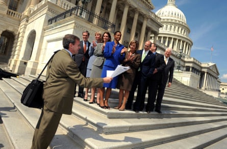 A man addresses members of Congress on the steps of the US Capitol