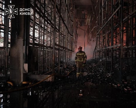 Rescuers working outside a warehouse premises damaged following massive Russian ballistic missile and drones strikes in the Ukrainian capital of Kyiv.