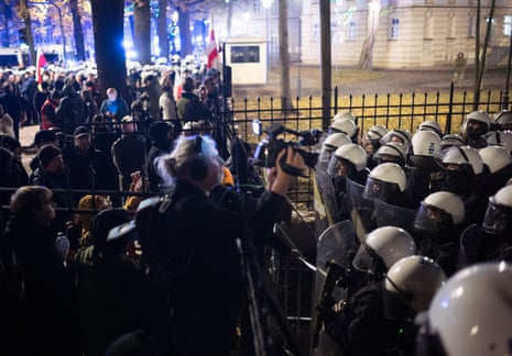 Police are seen around the premises of Poland's top constitutional court after its head was suspended in Warsaw, Poland, on Friday.