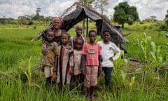 Bokwaya Angel Naonou, a 57-year-old grandmother, and her six grandchildren stand outside a shelter in their village in the Ivory Coast.