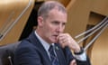 Michael Matheson sitting in Holyrood with a pensive expression