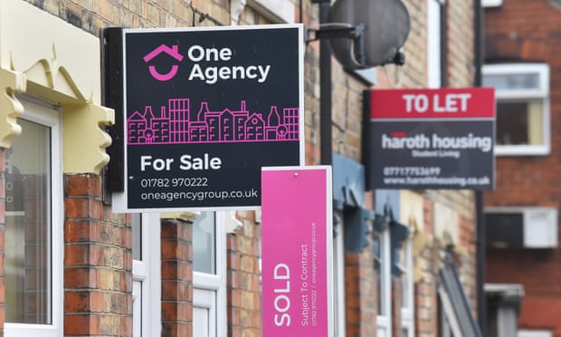 Placards from estates agents on properties in Stoke-on-Trent