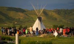 Hundreds of people gather for a vigil in a field where 751 human remains were discovered in unmarked graves by the Cowessess First Nation at the site of the former Marieval Indian residential school in Canada on 26 June