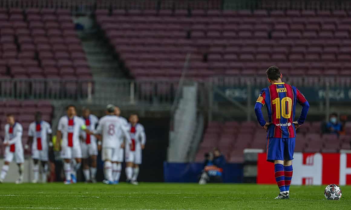 Lionel Messi watches PSG players celebrate a goal at Camp Nou.