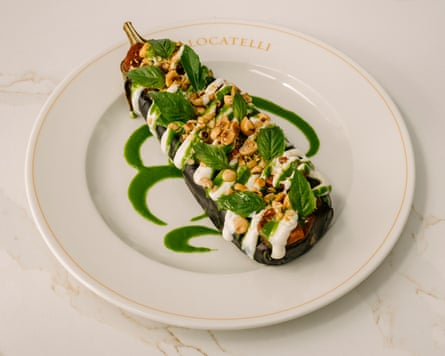 Melanzana, ricotta di soya, pomodorini, nocciole tostate, pesto di basilico, astatine Locatelli.