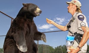 Joe Exotic, from Tiger King, with Boo, a North American black bear