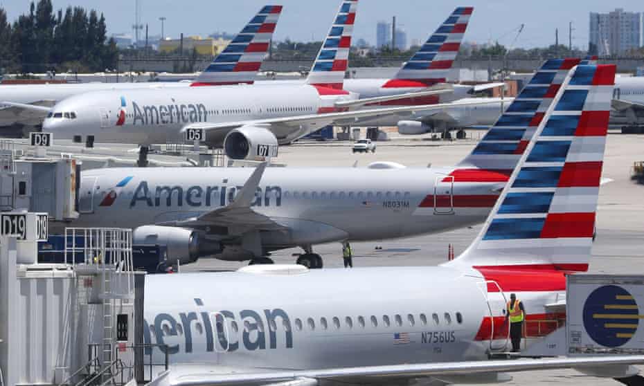 American Airlines aircraft are shown parked at their gates at Miami international airport in Miami, one of 17 airport where protests are planned to take place.