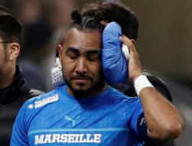 Dimitri Payet after being hit by a bottle.