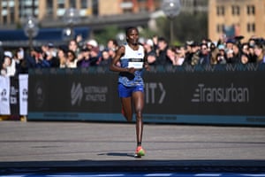 Brigid Kosgei of Kenya crosses the finish line in second place in the women’s race