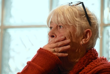 Moira Todd holds a hand to her face as she reacts during the press conference