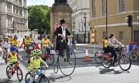 A man on a penny farthing