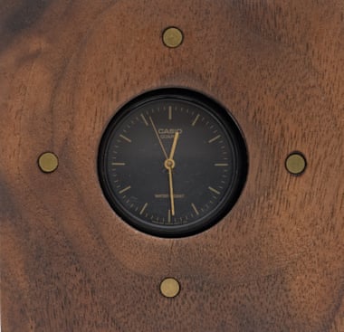 Time piece: a cheap but working watch upscaled in a walnut casing.