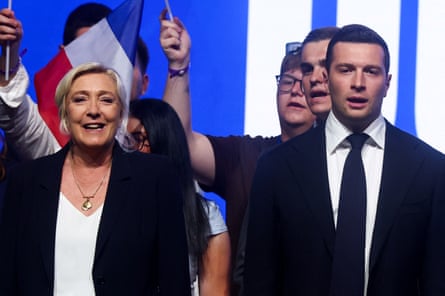 Marine Le Pen and Jordan Bardella attending a political rally on May Day.