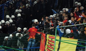 Police scuffle with Montenegro supporters during the Euro 2016 qualifying football match against Russia in Podgorica in March 2015.