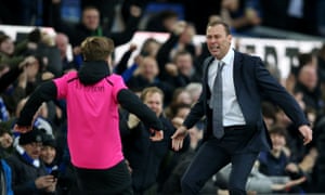 Duncan Ferguson, in temporary charge of Everton, celebrates his side’s third goal with a ballboy.