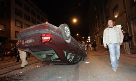 A car is left overturned by the violence in Tallinn in April 2007.