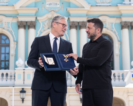 British prime minister Sir Keir Starmer is presented with the Order of Freedom by Ukrainian President Volodymyr Zelenskyy in the gardens of the Presidential Palace in Kyiv.