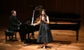 Fatma Said sings on stage with pianist Joseph Middleton backing her at a grand piano