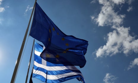 The flags of Greece and the EU fly in Athens