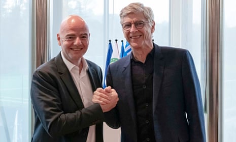 Fifa president Gianni Infantino shaking hands with Arsène Wenger in Zurich on Wednesday.