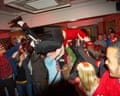 Person crowd surfing in the pub