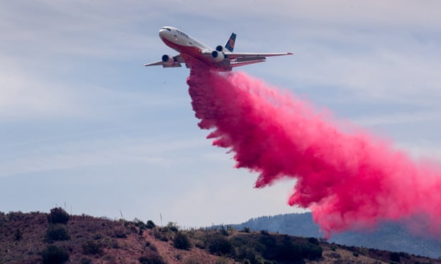 An air tanker drops slurry on the Telegraph fire, on 7 June 2021, at Cherry Flats, south of Miami, Arizona.