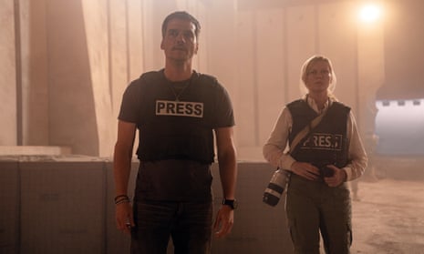 two people in vests that say press