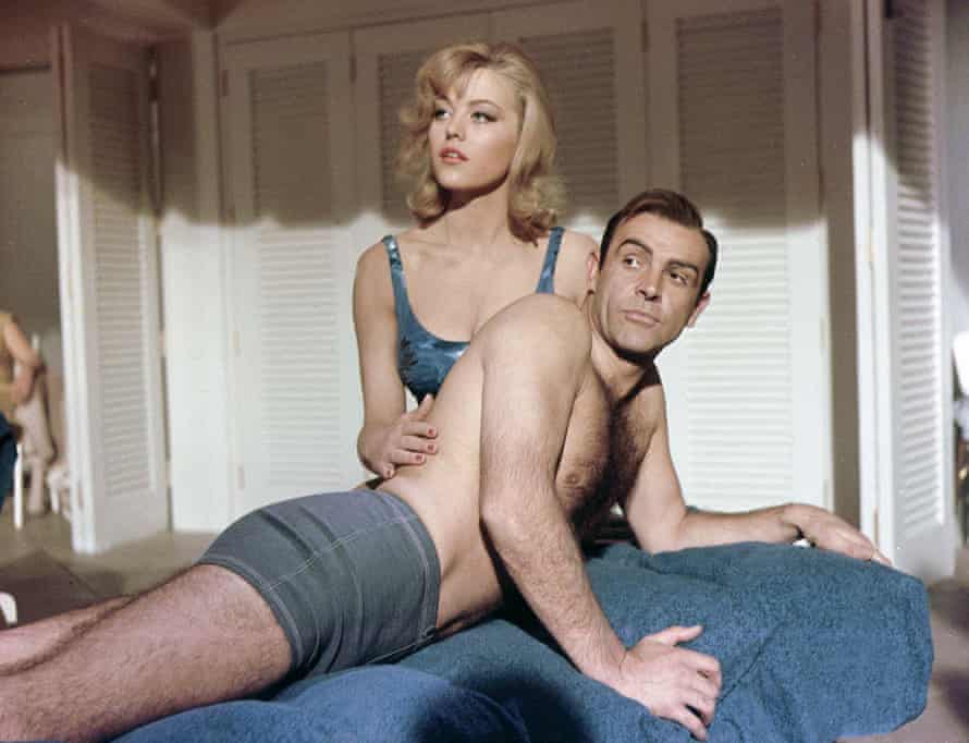 Margaret Nolan as Dink, with Sean Connery as James Bond, in Goldfinger, 1964.