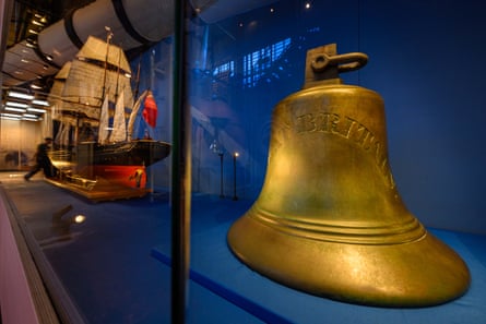 The ship’s bell in a glass case.